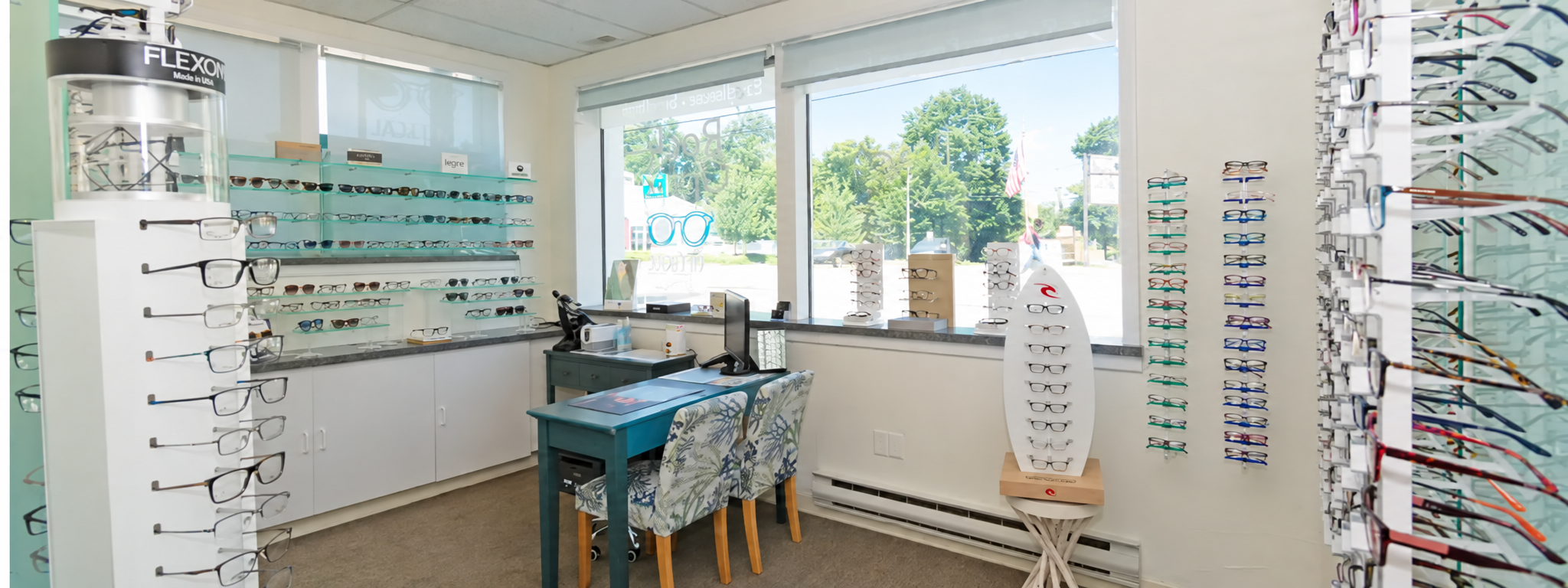 Eyeglass frames on display inside the Rock optiX optical shop in Millis