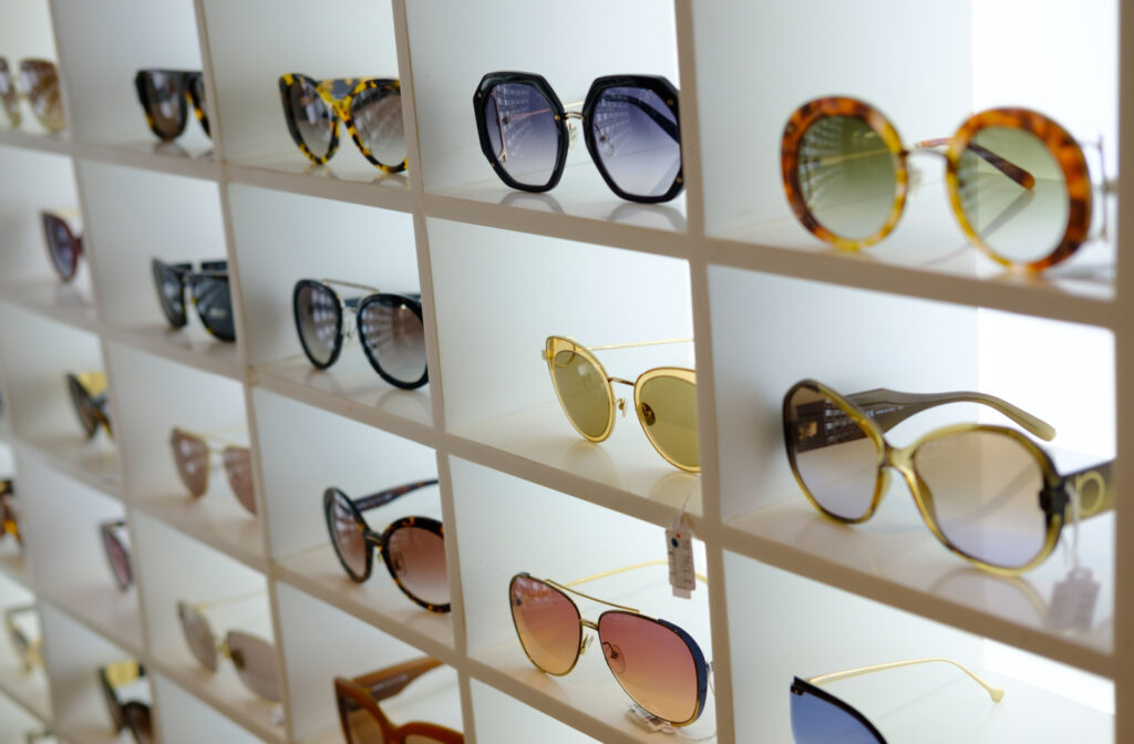 A display shelf of different styles of polarized sunglasses.